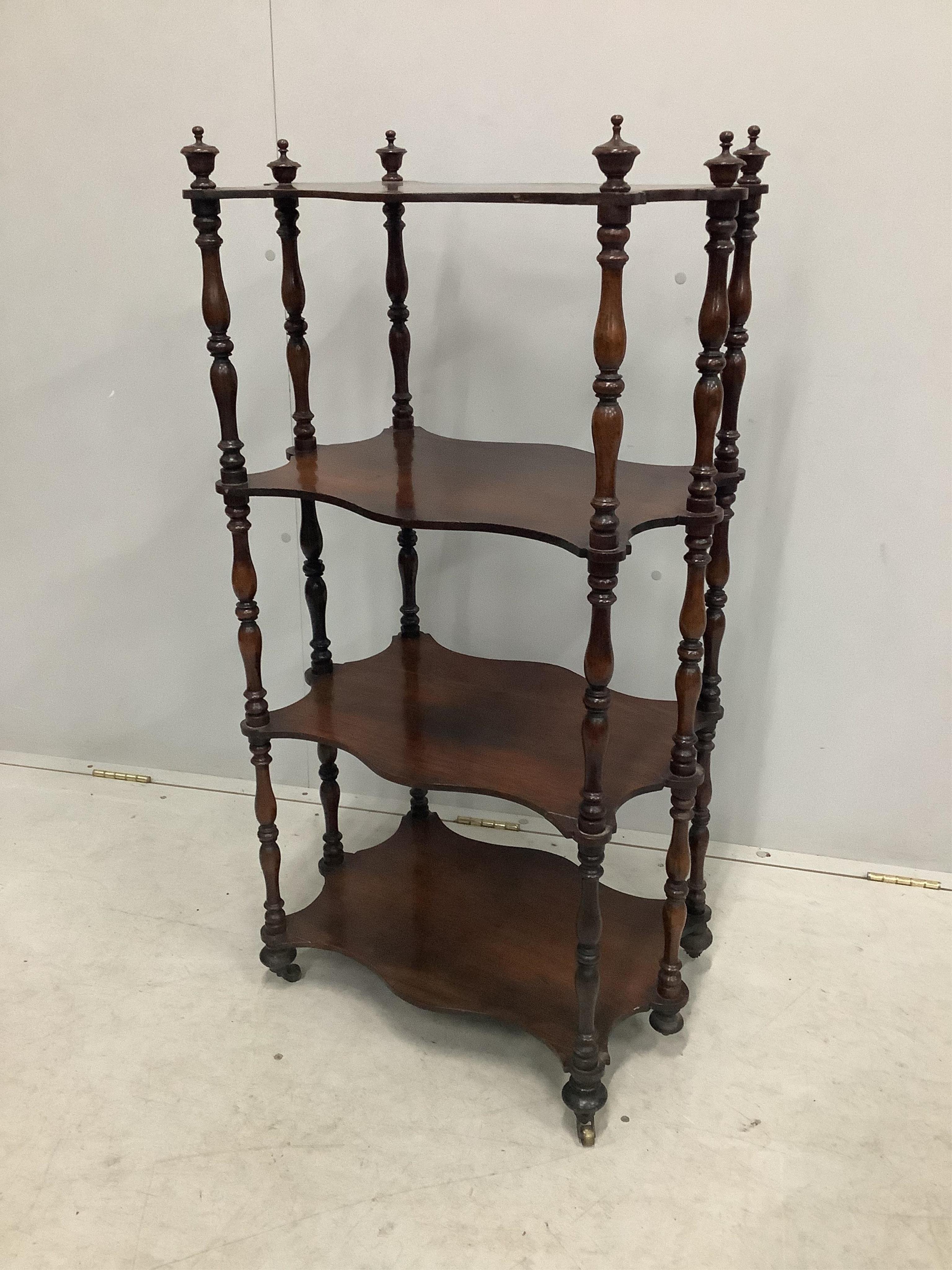 A Victorian four tier rosewood whatnot, width 57cm, depth 37cm, height 108cm. Condition - fair